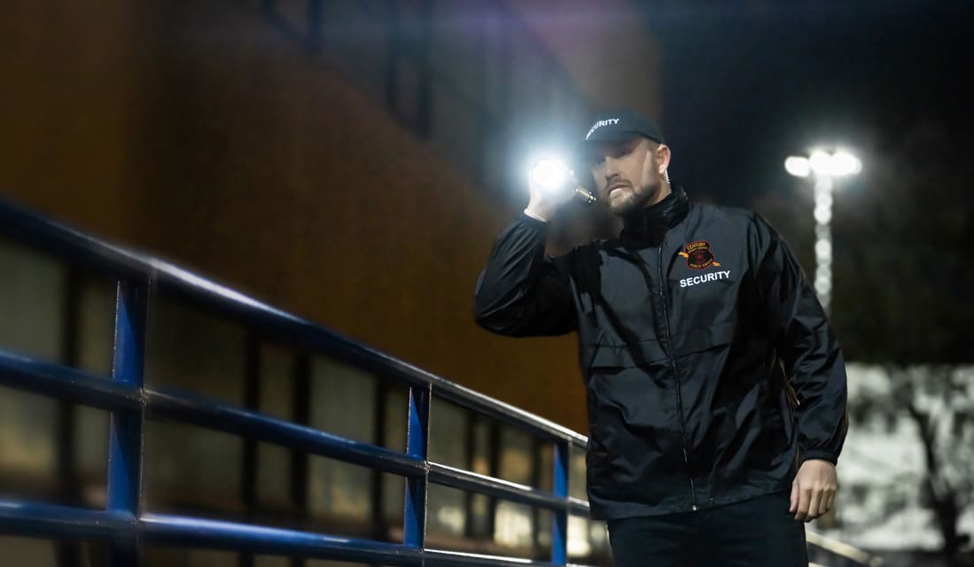 CSS-Hero-Mobile Security Guard shines his flashlight at night.